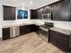 Modern kitchen featuring granite countertops and stainless steel appliances at 810 N Vandriver Way, Aurora, CO 80018