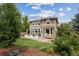 Landscaped backyard featuring a patio with seating and a grill at 2934 Braeburn Way, Highlands Ranch, CO 80126