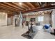 Unfinished basement with exposed beams, home gym, and water heater at 2934 Braeburn Way, Highlands Ranch, CO 80126