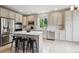 Updated kitchen features stainless appliances, breakfast bar, and ample counter space at 2934 Braeburn Way, Highlands Ranch, CO 80126
