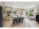 Modern kitchen with stainless steel appliances and a center island with seating at 2934 Braeburn Way, Highlands Ranch, CO 80126