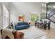 Bright living room features a soaring ceiling and modern decor at 2934 Braeburn Way, Highlands Ranch, CO 80126