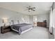 Inviting main bedroom with soft carpet, a ceiling fan, and stylish furnishings at 2934 Braeburn Way, Highlands Ranch, CO 80126