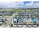 An aerial view showcases the neighborhood's charming colorful homes and large park with the mountains as a scenic backdrop at 5880 Beeler Ct, Denver, CO 80238