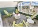 Covered balcony with outdoor seating, offering a relaxing space and neighborhood views at 5880 Beeler Ct, Denver, CO 80238
