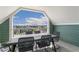 Inviting balcony offering great views and a table set with four chairs at 5880 Beeler Ct, Denver, CO 80238