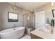 Modern bathroom featuring a stand alone soaking tub, glass shower, and double vanity at 5880 Beeler Ct, Denver, CO 80238