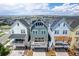 Home exterior featuring a charming pergola-covered balcony and garage at 5880 Beeler Ct, Denver, CO 80238