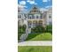 Beautiful home with a green lawn, landscaped garden, and a classic front porch entrance at 5880 Beeler Ct, Denver, CO 80238