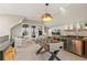 Bright, airy game room with a foosball table, TV, wet bar and seating area, perfect for entertainment at 5880 Beeler Ct, Denver, CO 80238