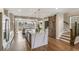 Bright kitchen featuring a waterfall island, modern cabinetry, and stainless steel appliances at 5880 Beeler Ct, Denver, CO 80238