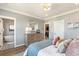 Tranquil main bedroom with ensuite bathroom access, hardwood floors, and a walk-in closet at 5880 Beeler Ct, Denver, CO 80238