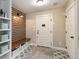 Convenient mudroom features a built-in bench, storage cubbies, and stylish patterned tile flooring at 5880 Beeler Ct, Denver, CO 80238