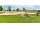 Picturesque park scene with volleyball courts, picnic tables, and lush green grass at 5880 Beeler Ct, Denver, CO 80238