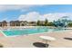 Spacious community pool with lounge areas and colorful cabanas nearby at 5880 Beeler Ct, Denver, CO 80238