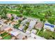 Aerial view of a neighborhood showcasing homes and a nearby golf course at 2421 N York St, Denver, CO 80205