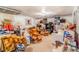 Unfinished basement with carpet and a variety of boxes and furniture at 2421 N York St, Denver, CO 80205