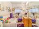 Bathroom with a tub, white tile, a wood vanity, and purple towels and rugs at 2421 N York St, Denver, CO 80205