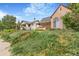 View of a charming home situated on a lot with lush landscaping at 2421 N York St, Denver, CO 80205