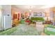 A charming living room is perfect for Gathering gatherings with green accents and soft lighting at 2421 N York St, Denver, CO 80205