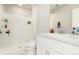 Bright bathroom features a stand-up shower, white marble floors, and sleek white countertops at 1353 Reynolds St # 16B, Fort Lupton, CO 80621