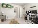 Bedroom featuring a Boston Celtics theme, desk, and a doorway to the ensuite bathroom at 1353 Reynolds St # 16B, Fort Lupton, CO 80621