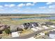 Aerial view of neighborhood with lake views, manicured lawns and walking trails at 27381 E Lakeview Dr, Aurora, CO 80016