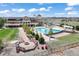 Community clubhouse featuring a pool, fire pit, and outdoor seating areas at 27381 E Lakeview Dr, Aurora, CO 80016