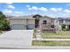 Charming two-story home with a three-car garage and stone accents at 27381 E Lakeview Dr, Aurora, CO 80016
