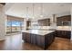 Spacious kitchen featuring a large island, stainless steel appliances, and ample natural light at 27381 E Lakeview Dr, Aurora, CO 80016