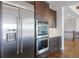 Kitchen with stainless steel appliances, including a refrigerator and double wall oven at 27381 E Lakeview Dr, Aurora, CO 80016