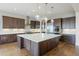 Beautiful kitchen with a large island, stainless steel appliances, and pendant lighting at 27381 E Lakeview Dr, Aurora, CO 80016