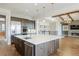 Bright kitchen with an island, stainless steel appliances, and an open floor plan at 27381 E Lakeview Dr, Aurora, CO 80016