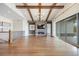 Spacious living room features a cozy fireplace, large windows with sliding glass doors, and hardwood flooring at 27381 E Lakeview Dr, Aurora, CO 80016
