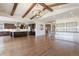 Bright and airy living space featuring hardwood floors, a modern kitchen, and a view of the elegant foyer at 27381 E Lakeview Dr, Aurora, CO 80016