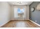 Bright living room featuring hardwood floors, neutral walls, large windows with view at 27381 E Lakeview Dr, Aurora, CO 80016