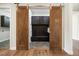 Spacious mudroom features custom cabinetry, bench seating, and beautiful barn doors at 27381 E Lakeview Dr, Aurora, CO 80016