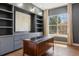 Office space with built-in bookshelves and a large window offering natural light at 27381 E Lakeview Dr, Aurora, CO 80016