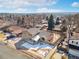 Aerial view of a charming home with a well-kept lawn, a welcoming fence, and convenient street access at 7076 W 83Rd Way, Arvada, CO 80003