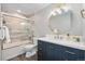 Stylish bathroom with a new vanity, elegant fixtures, and a tiled shower with glass doors at 7076 W 83Rd Way, Arvada, CO 80003