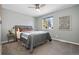 Comfortable bedroom featuring a large bed, soft carpet, and natural light from the window at 7076 W 83Rd Way, Arvada, CO 80003