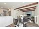 Cozy breakfast nook with seating for two overlooks the modern kitchen and bright, open living space at 7076 W 83Rd Way, Arvada, CO 80003