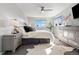 Bright main bedroom with a ceiling fan and dual windows, features neutral tones and cozy decor at 7076 W 83Rd Way, Arvada, CO 80003