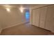 Bedroom with closet and small window, offering a simple and functional space at 8094 Kline Ct, Arvada, CO 80005