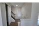 Bright entryway featuring hardwood floors, a coat closet, and staircase at 8094 Kline Ct, Arvada, CO 80005