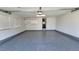 Spacious garage with epoxy flooring and ample storage cabinets at 8094 Kline Ct, Arvada, CO 80005