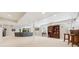 Finished basement featuring neutral carpet, support beams, and media room area at 5134 S Ouray Ct, Centennial, CO 80015