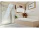 Bathroom features a walk-in shower, soaking tub and window at 5134 S Ouray Ct, Centennial, CO 80015