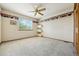 Bedroom with light-colored carpet, border wallpaper, and ceiling fan at 5134 S Ouray Ct, Centennial, CO 80015