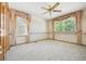 Bedroom with light-colored carpet and wallpaper border with decorative curtains at 5134 S Ouray Ct, Centennial, CO 80015